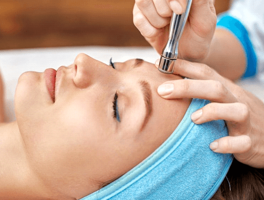 Woman Receiving Microdermabrasion Facial