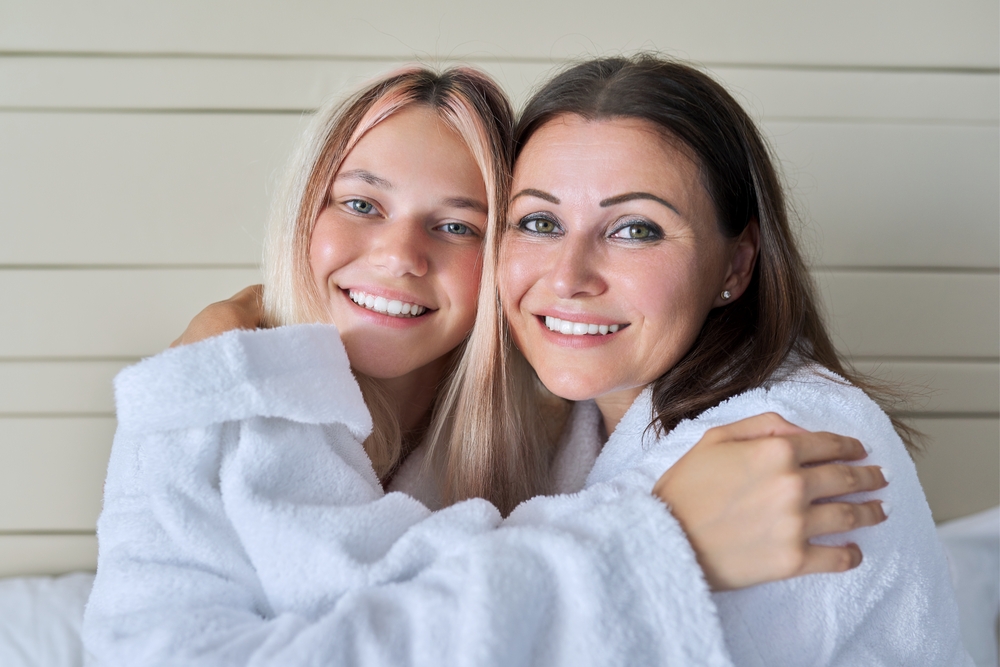 Close up portrait of happy smiling mom and teenage daughter. Family, relationship parent child teenager